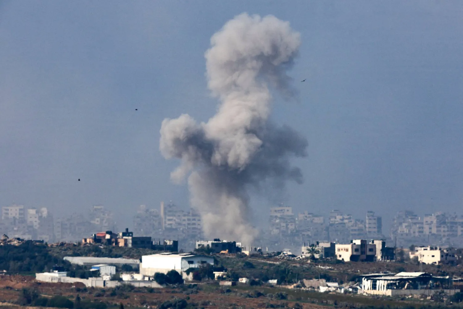 Smoke rises over central Gaza following a strike, amid the ongoing conflict between Israel and the Palestinian Islamist group Hamas, as seen from southern Israel, January 1, 2024. REUTERS/Amir Cohen