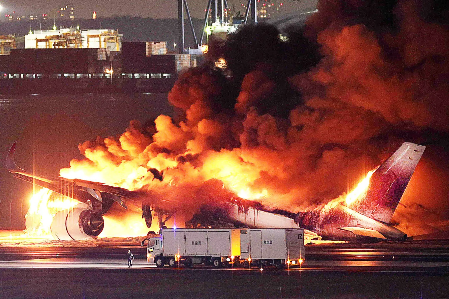 This photo provided by Jiji Press shows a Japan Airlines plane on fire on a runway of Tokyo's Haneda Airport on January 2, 2024. (Photo by JIJI PRESS / AFP) / Japan OUT
