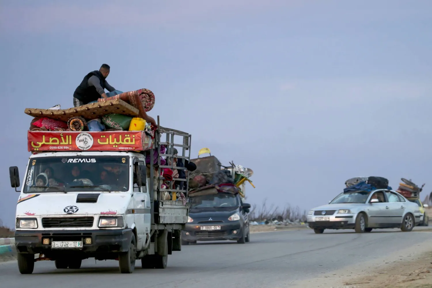 Residents of Al Nusairat and Al Bureije refugee camps evacuate following an Israeli warning of increased military operations in the camps in the southern Gaza Strip, 03 January 2024. EPA/MOHAMMED SABER