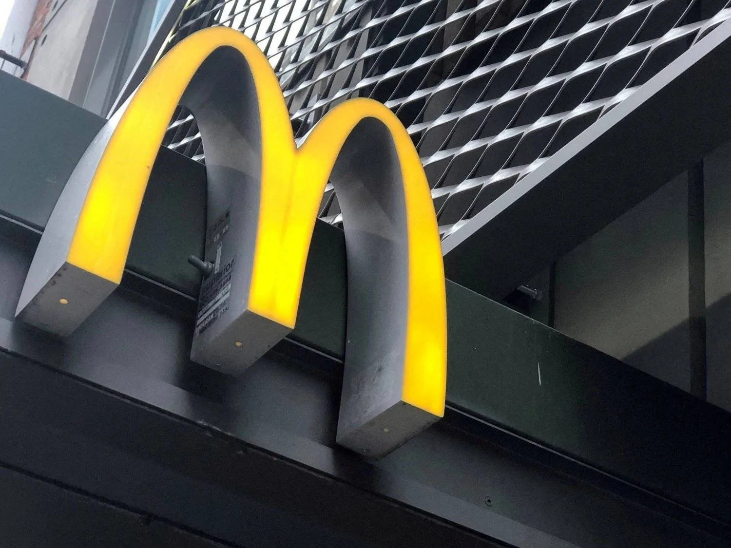 FILE PHOTO: The McDonald's logo is seen outside the fast-food chain McDonald's in New York, US, October 22, 2019. REUTERS/Shannon Stapleton/File Photo