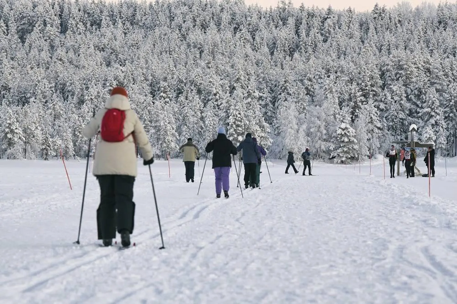 People ski in the town of Akaslompolo, in Finnish Lapland, Thursday Jan. 4, 2024. (AP)