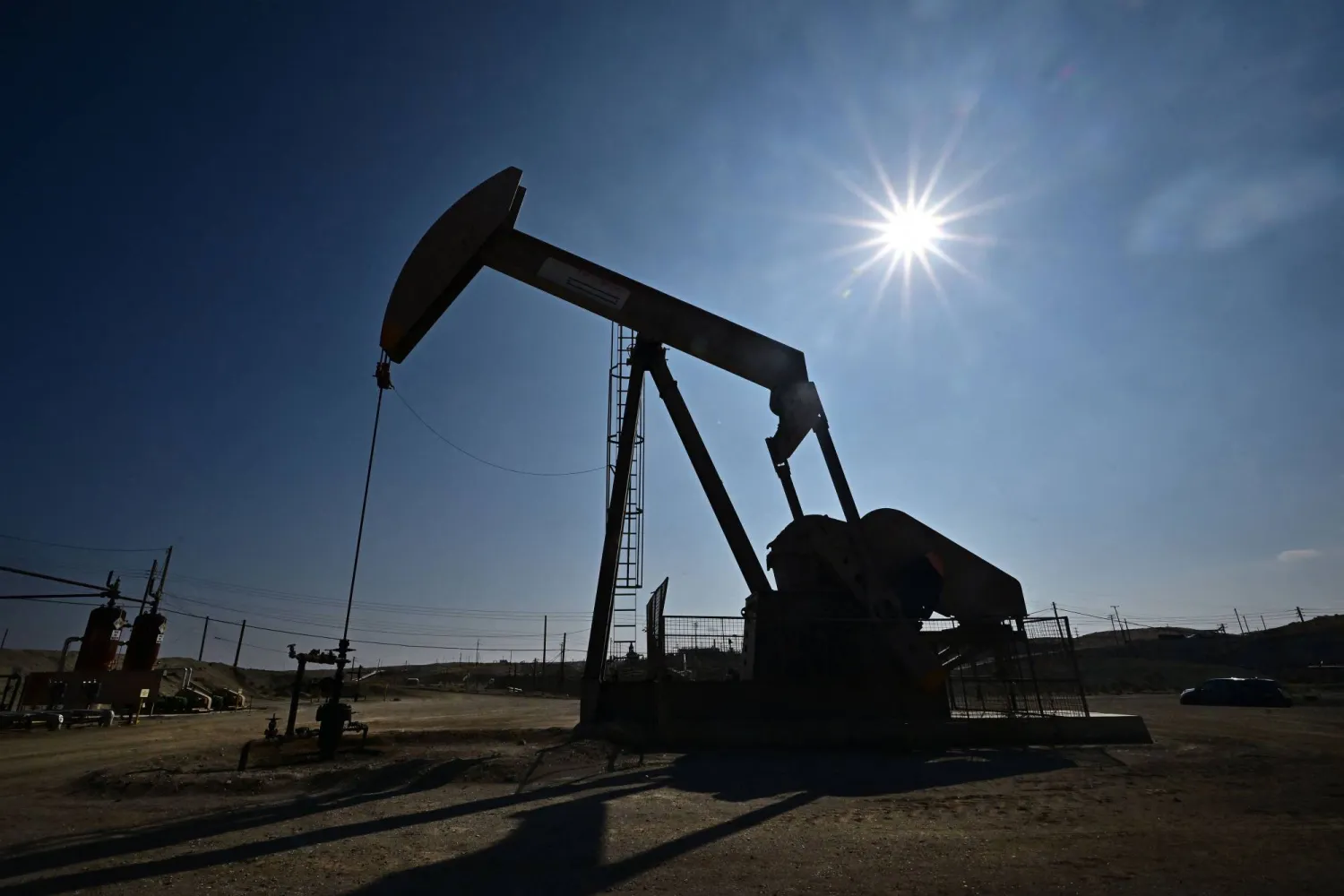 (FILES) A working oil pumpjack is pictured in Taft, Kern County, California on September 21, 2023. US energy company APA Corporation has agreed to buy competitor Callon Petroleum in a transaction valued around $4.5 billion including debt, the firms announced January 4, 2024, marking the latest deal in the sector. (Photo by Frederic J. BROWN / AFP)
