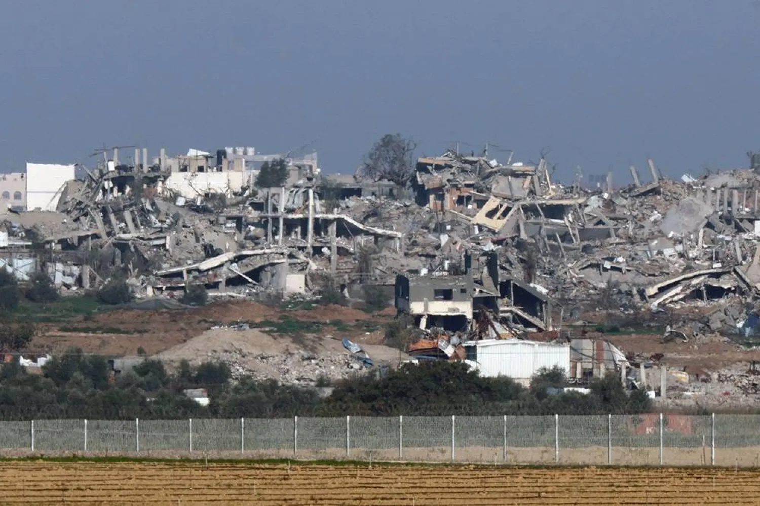 Buildings destroyed by Israeli bombardment in the Gaza Strip are pictured from a position along the border in southern Israel on January 5, 2024, amid the ongoing conflict between Israel and the Palestinian militant group Hamas. (AFP)