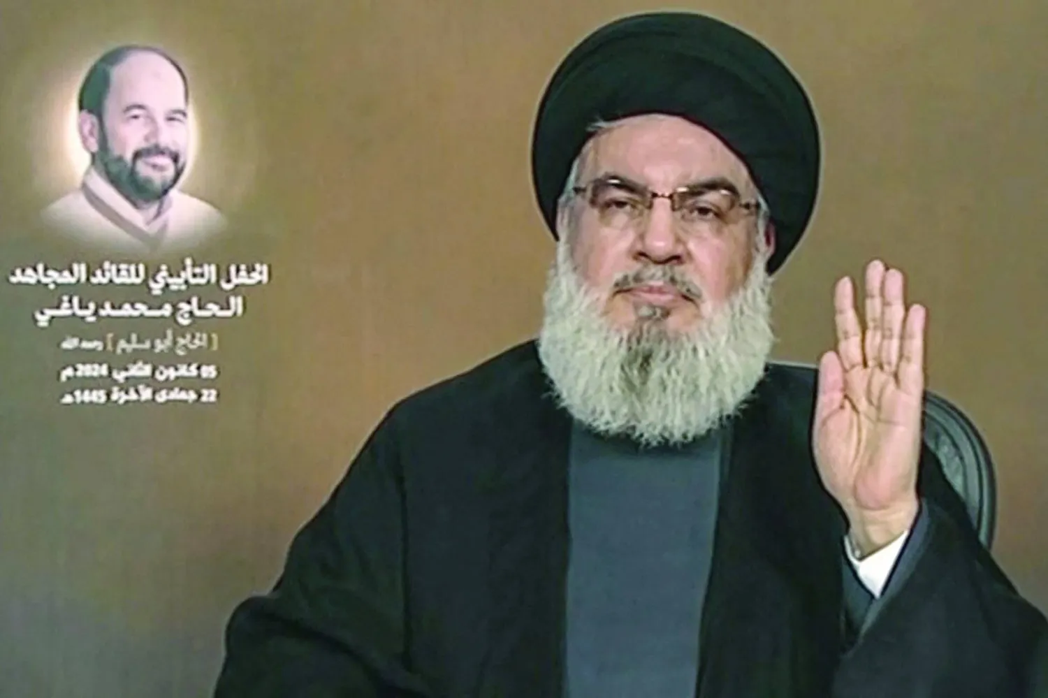 
نصر الله يتحدث عبر الشاشة (أ.ف.ب)