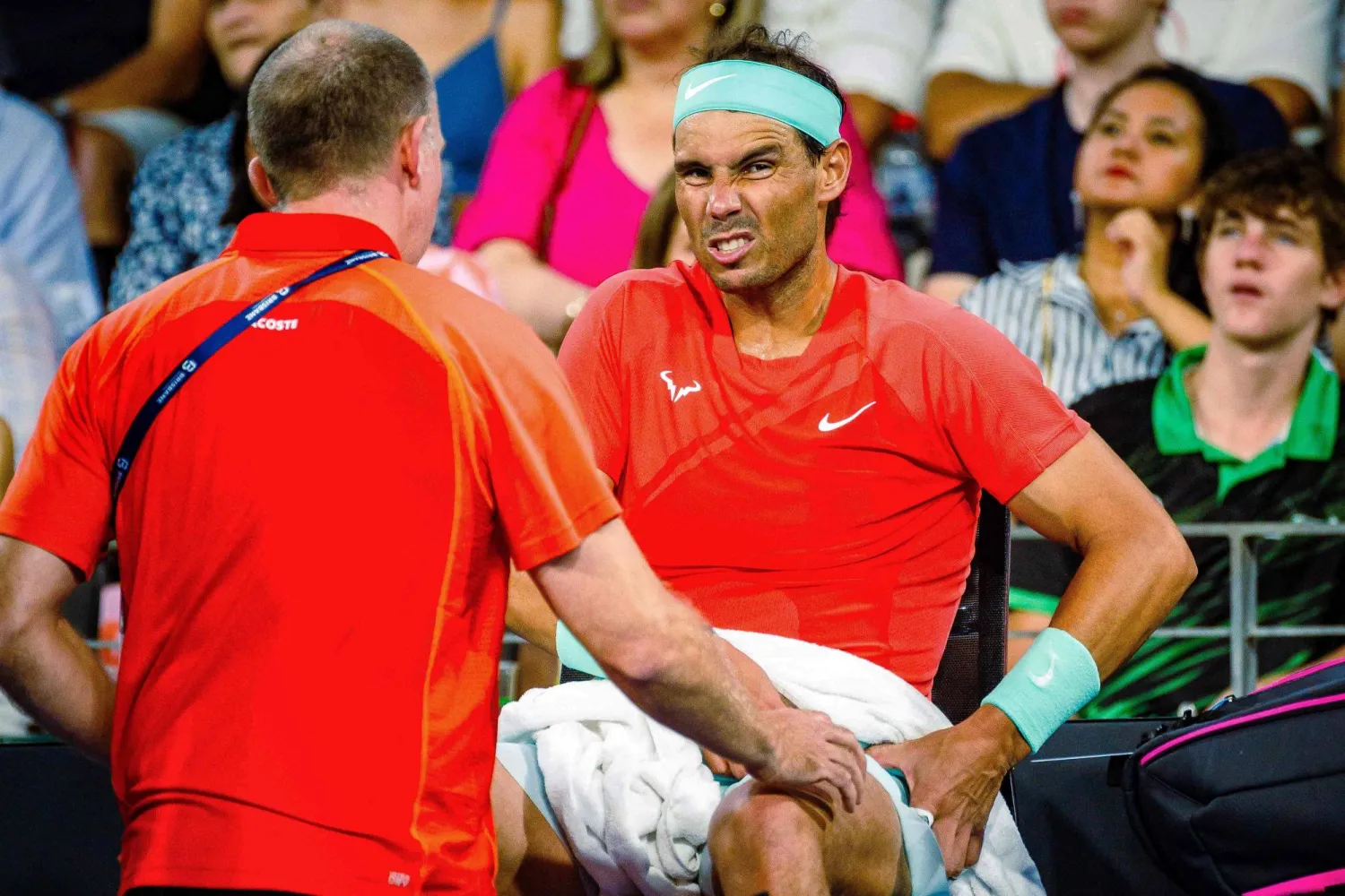Spain's Rafael Nadal receives medical treatment for his hip during the third set of play against Australia's Jordan Thompson at their men's singles match during the Brisbane International tennis tournament in Brisbane on January 5, 2024. (Photo by Patrick HAMILTON / AFP)