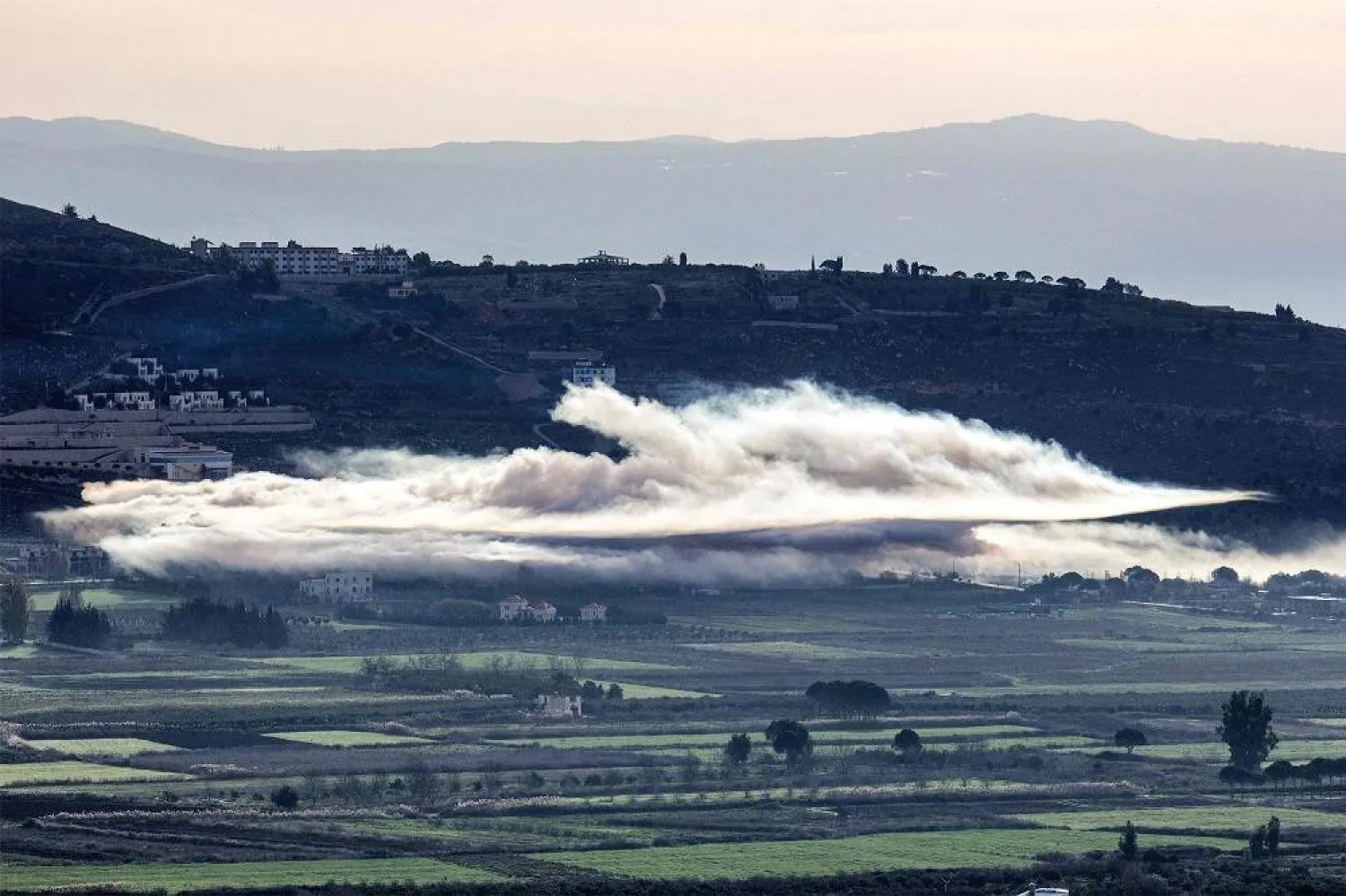Smoke billows from Israeli bombardment in the Khiyam plains near the border with Israel in southern Lebanon on January 8, 2024 amid ongoing cross-border tensions as fighting continues between Israel and Hamas militants in the Gaza Strip. (AFP)