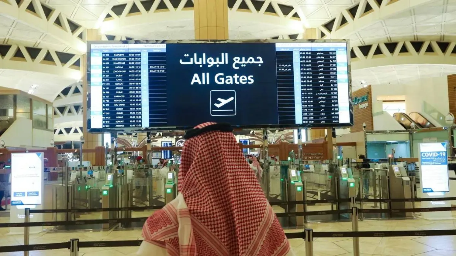 A Saudi man checks the flight timings at the King Khalid International Airport, in Riyadh, Saudi Arabia, May 16, 2021. (Reuters)