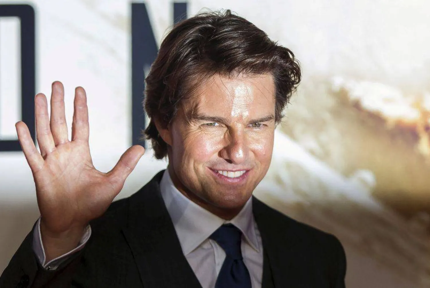 FILE PHOTO: US actor Tom Cruise poses for photographers at a British screening of the film "Mission Impossible: Rogue Nation" in London, Britain July 25, 2015. REUTERS/Neil Hall/File Photo
