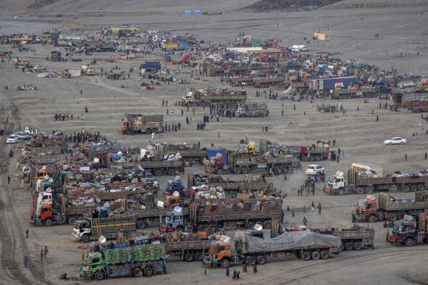 FILE- Afghan refugees settle in a camp near the Torkham Pakistan-Afghanistan border, in Torkham, Afghanistan, Friday, Nov. 3, 2023. (AP Photo/Ebrahim Noroozi, File) 