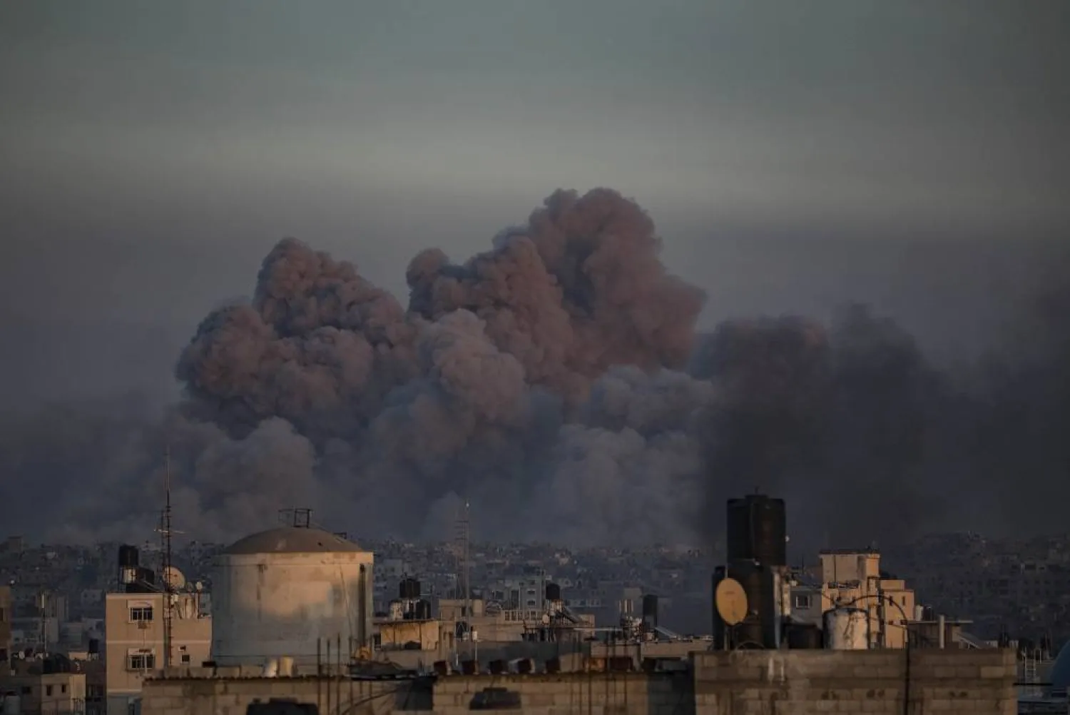 Smoke rises following Israeli air strikes in Khan Younis, southern Gaza Strip, 16 January 2024. (EPA)