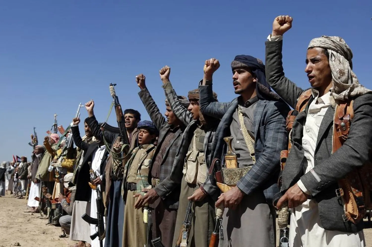 Houthi fighters and tribesmen stage a rally against the US and the UK strikes on Houthi-run military sites near Sanaa, Yemen, on Sunday, Jan. 14, 2024. (AP) 