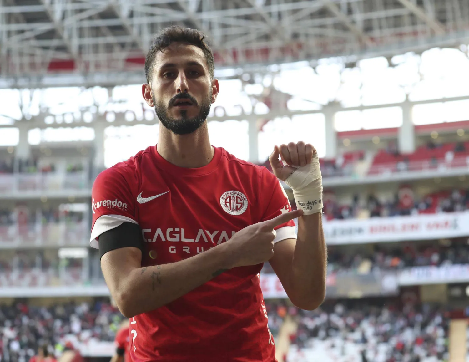FILE - Antalyaspor's Sagiv Jehezkel points a message in his bandage that reads: "100 days. 7.10" as he celebrates after scoring his side's first goal during a Turkish Super Lig soccer match between Antalyaspor and Trabzonspor in Antalya, southern Turkey, Sunday, Jan. 14, 2024. (Adem Akalan/DHA via AP, File)