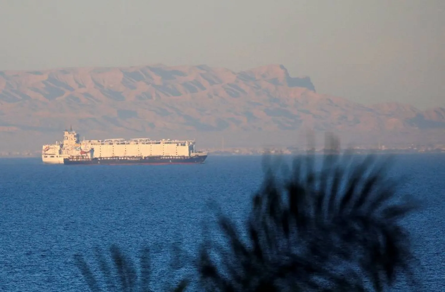 Container ships sail across the Gulf of Suez towards the Red Sea before entering the Suez Canal, in El Ain El Sokhna in Suez, east of Cairo, Egypt, March 17, 2018. Picture taken March 17, 2018. (Reuters)