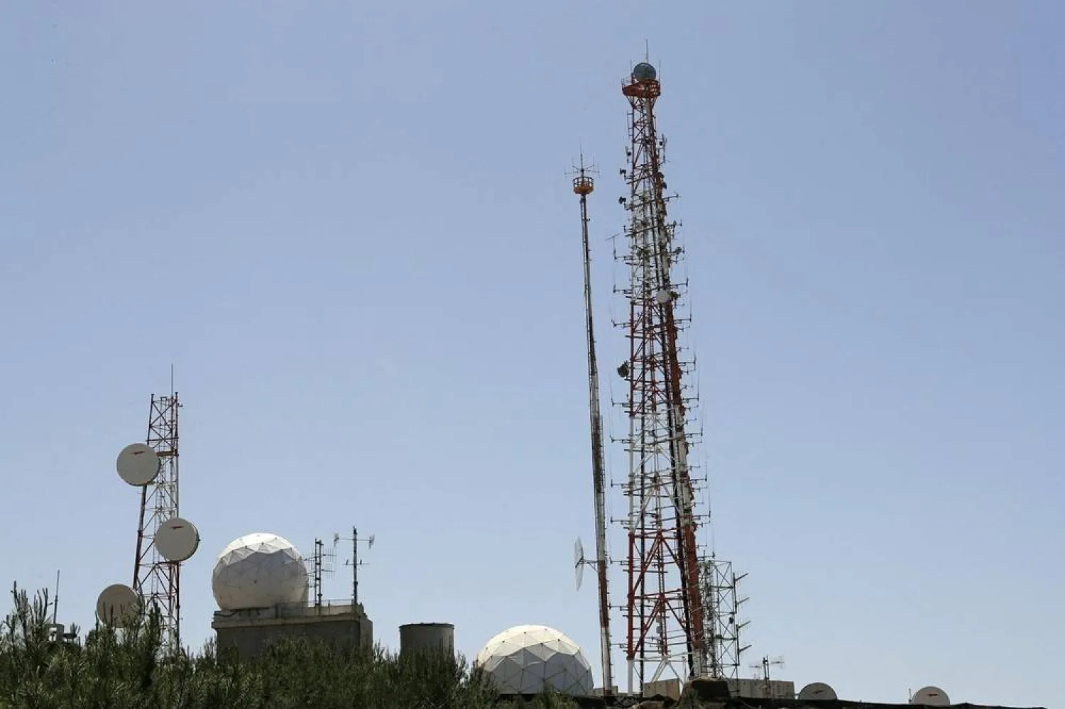 A picture taken from Naqoura in southern Lebanon shows an Israeli observation station along the border near Kibbutz Hanita on April 20, 2017. (AFP)