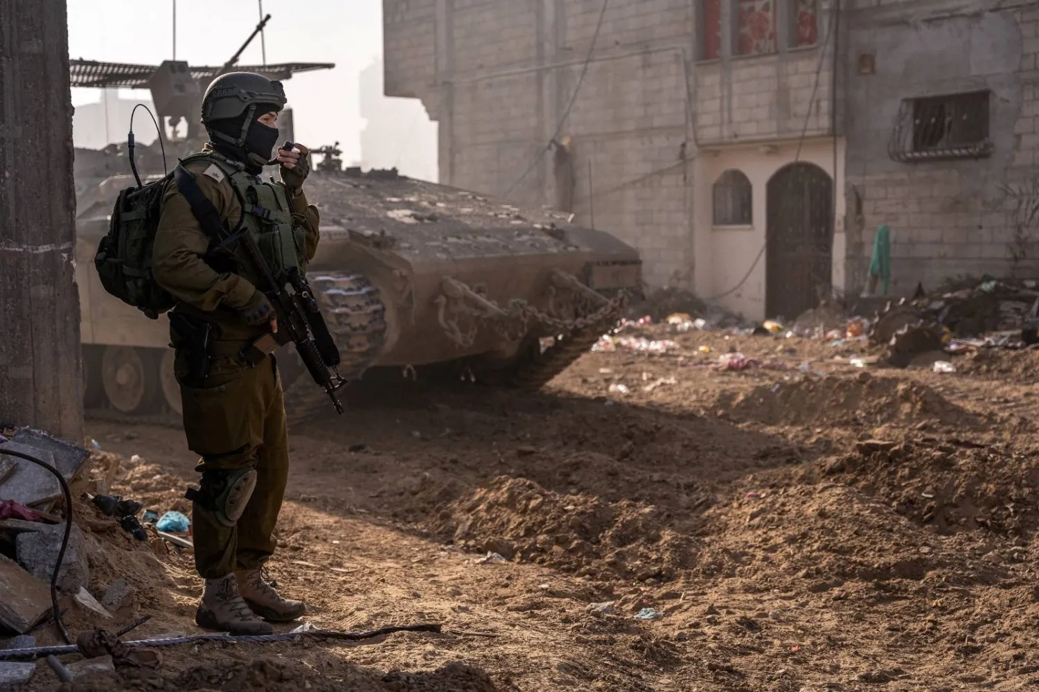  An Israeli soldier takes part in a ground operation, amid the ongoing conflict between Israel and the Palestinian group Hamas, in a location given as Gaza Strip, in this handout picture released on January 19, 2024. Israeli Army Handout/Handout via REUTERS