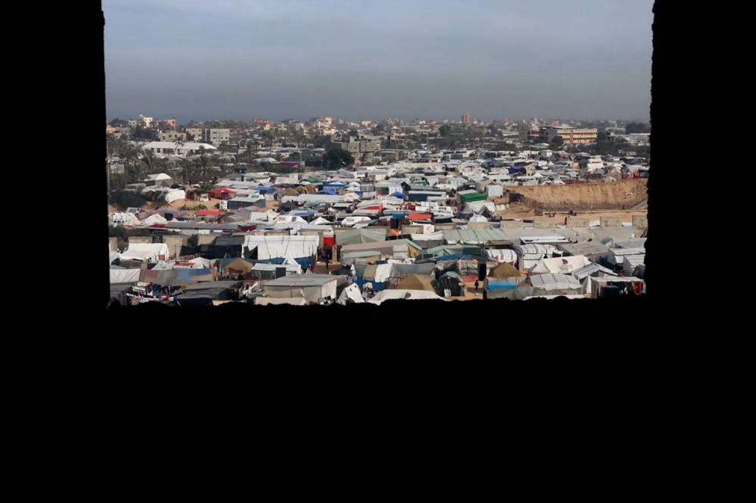  Displaced Palestinians, who fled their houses due to Israeli strikes, take shelter in a tent camp in Rafah in the southern Gaza Strip January 21, 2024. (Reuters)