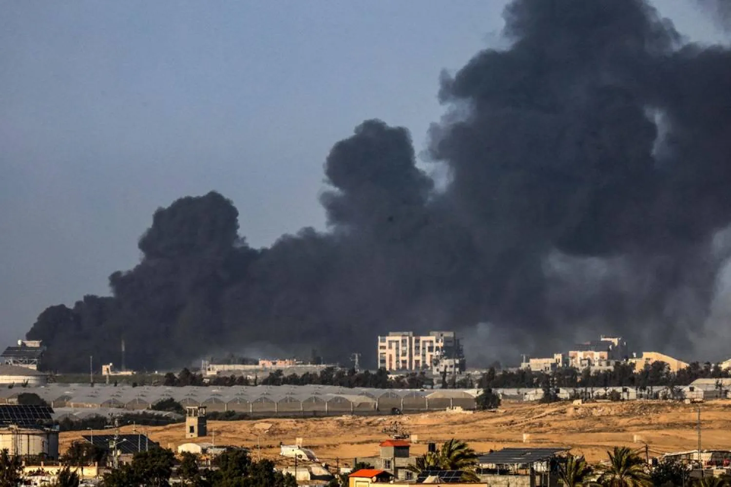  A picture taken from Rafah shows smoke billowing over Khan Younis in the southern Gaza Strip during Israeli bombardment on January 22, 2024, amid ongoing battles between Israel and the Palestinian militant group Hamas. (AFP) 