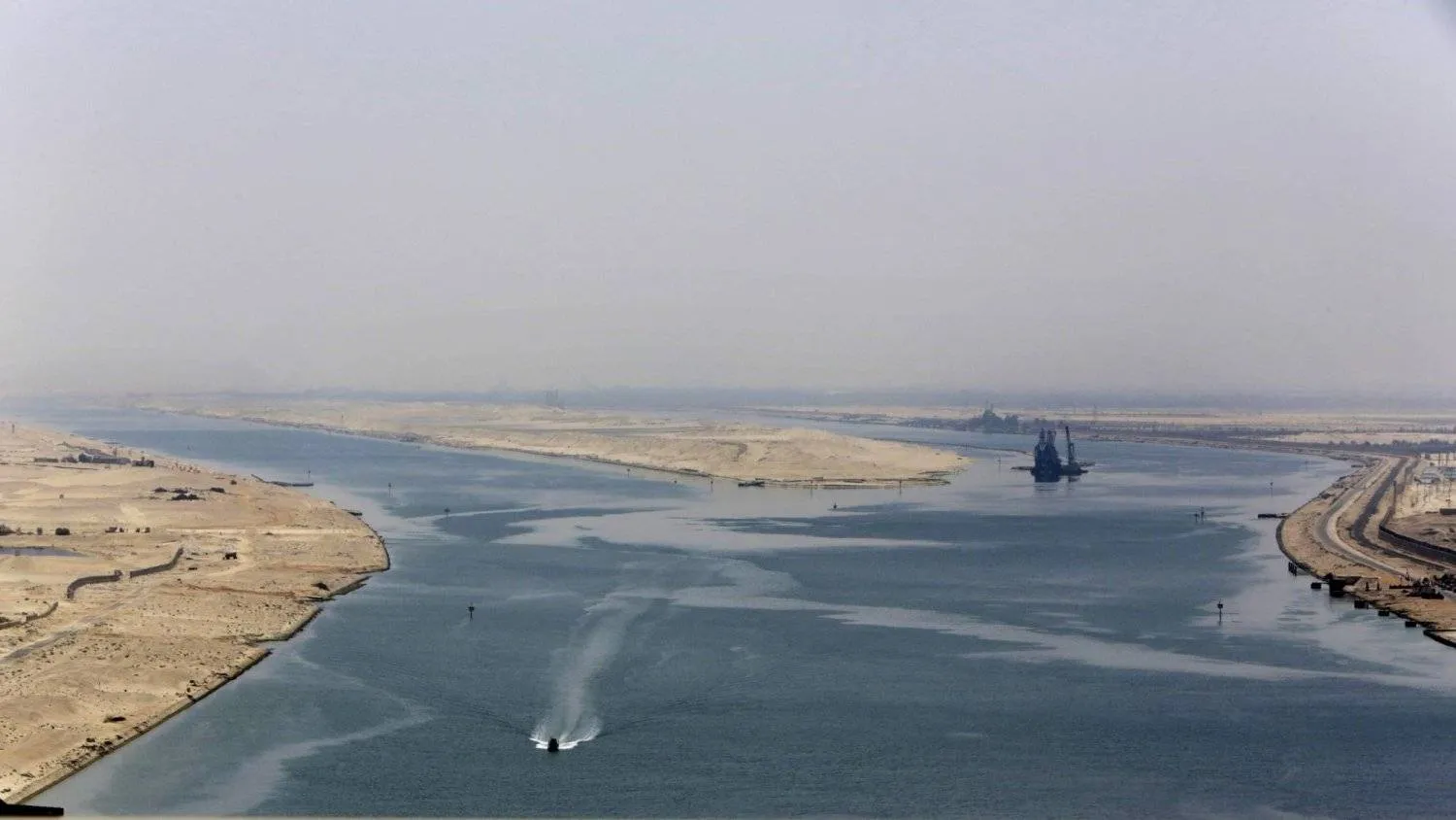 A naval forces boat secures one of the areas of the Suez Canal near the Egyptian city of Ismailia. (AP) 
