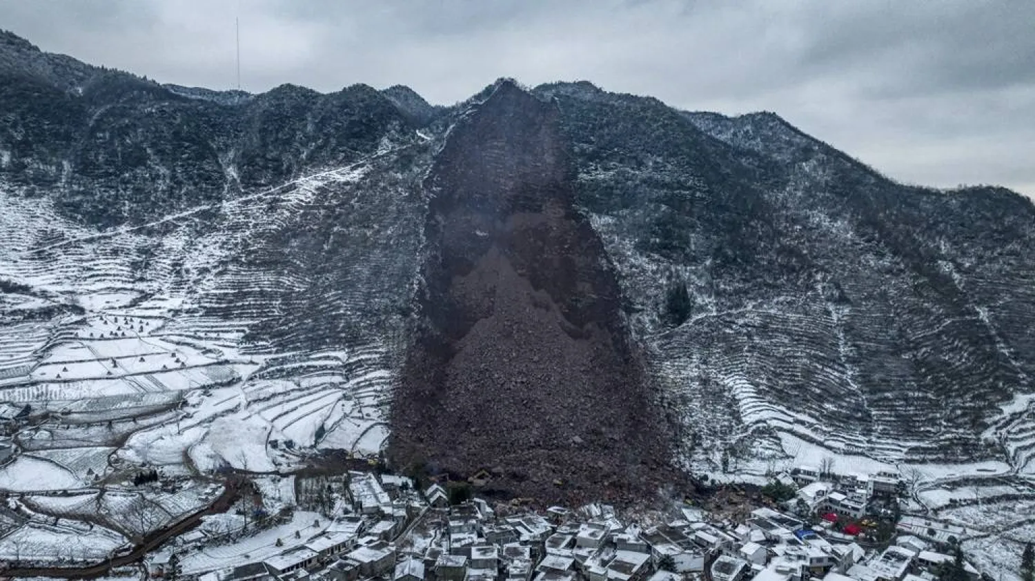 Forty-four people were killed when a landslide slammed into houses at the foot of a slope early Monday morning in Liangshui, a village in a remote and mountainous part of Yunnan province. (EPA/XINHUA / Hu Chao) 