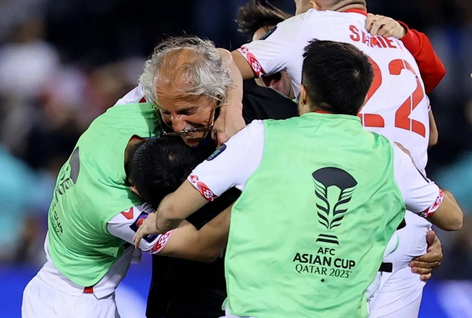 Football - AFC Asian Cup - Group A - Tajikistan v Lebanon - Jassim bin Hamad Stadium, Al Rayyan, Qatar - January 22, 2024 Tajikistan coach Petar Segrt celebrates with the players after the match. (Reuters)