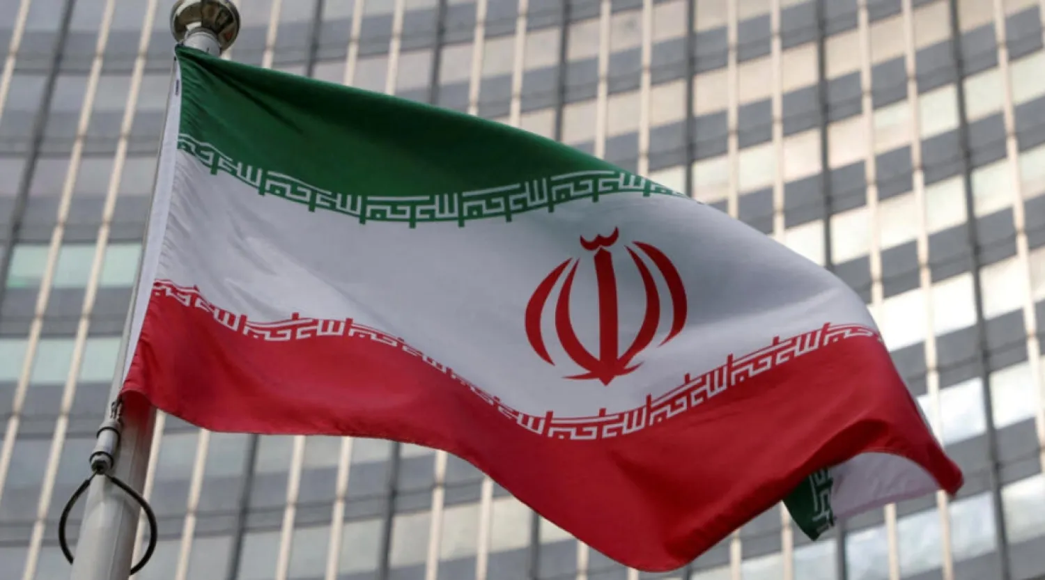 A file photo showing the Iranian flag in front of the International Atomic Energy Agency (IAEA) organisation's headquarters in Vienna, Austria, June 5, 2023. © Leonhard Foeger, Reuters
