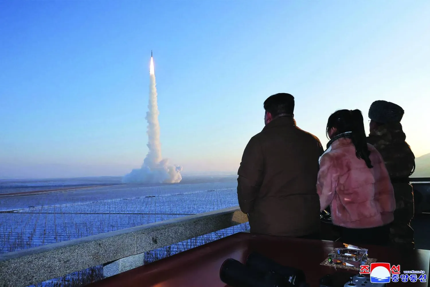 This undated picture released by North Korea's official Korean Central News Agency (KCNA) on December 19, 2023 shows North Korean leader Kim Jong Un (L) and his daughter watching the test launch of a Hwasongpho-18 intercontinental ballistic missile (ICBM) at an undisclosed location in North Korea. (Photo by KCNA VIA KNS / AFP)