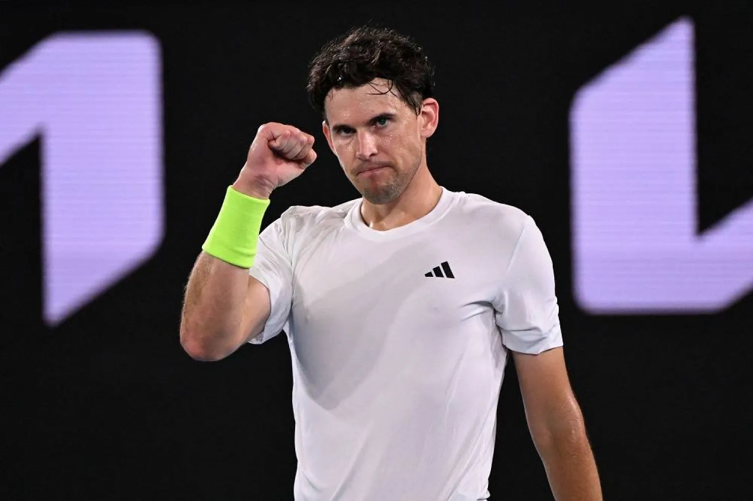 Austria's Dominic Thiem reacts after winning the fourth set against Canada's Felix Auger-Aliassime during their men's singles match on day two of the Australian Open tennis tournament in Melbourne on January 16, 2024. (AFP)