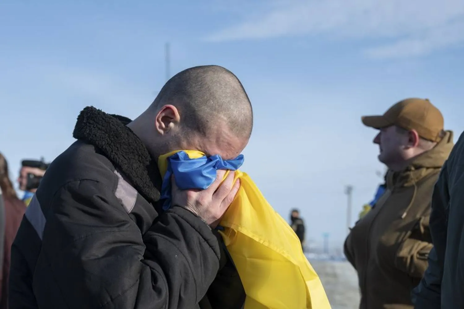 A handout photo made available by the Presidential Press Service showing released Ukrainian prisoners of war as they reach Ukraine-controlled territory at an undisclosed location near the Ukraine-Russia border, 31 January 2024 amid the Russian invasion. (EPA/Presidential Press Service Handout)