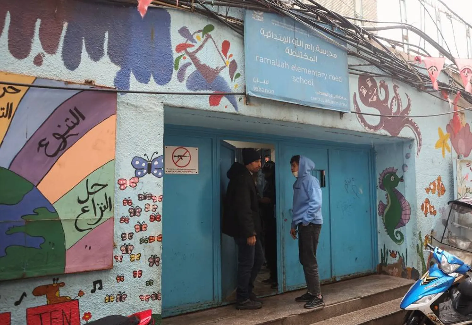  Palestinians stand outside a school run by United Nations Relief and Works Agency (UNRWA) at Shatila Palestinian refugee camp, in Beirut suburbs, Lebanon January 30, 2024. (Reuters)
