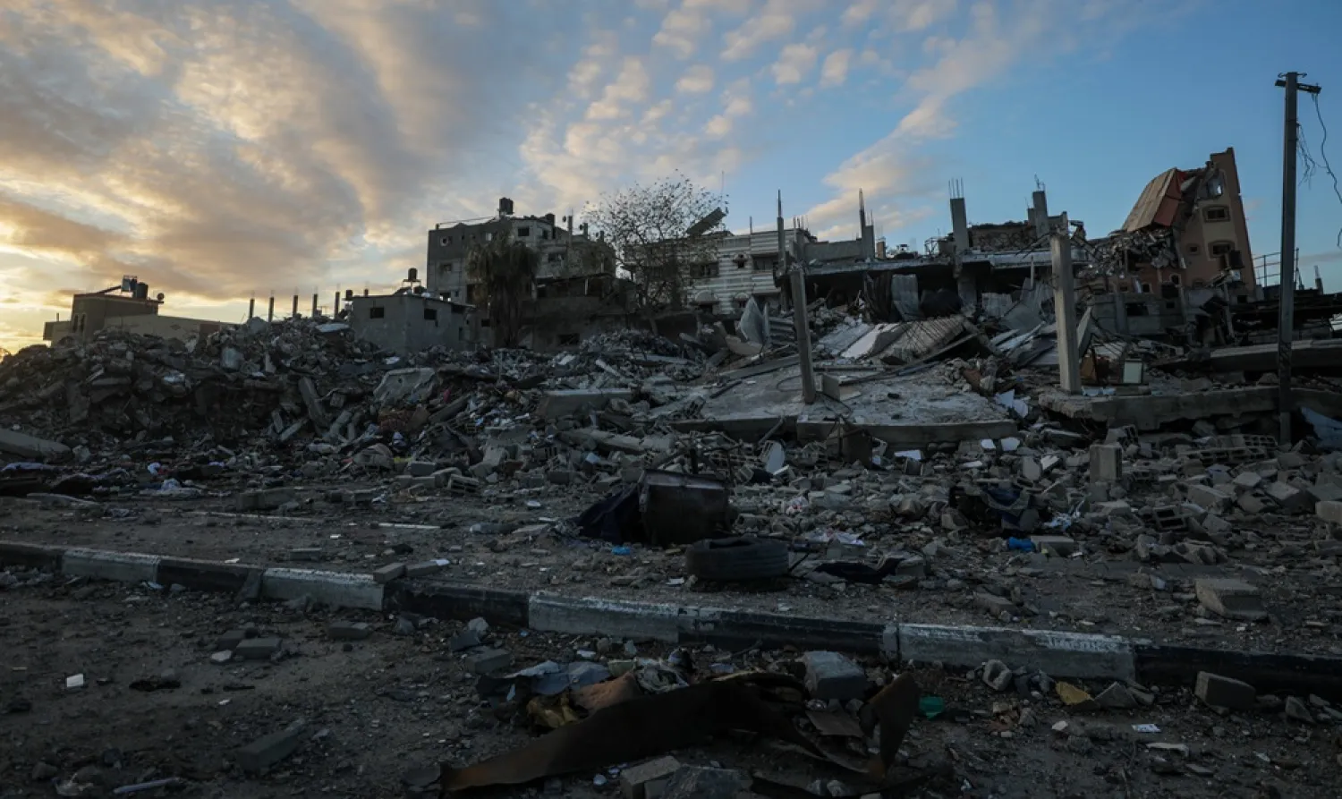 A view of a destroyed houses during an Israeli military operation in Al Bureij refugee camp in the southern Gaza Strip, 24 January 2024. (EPA) 
