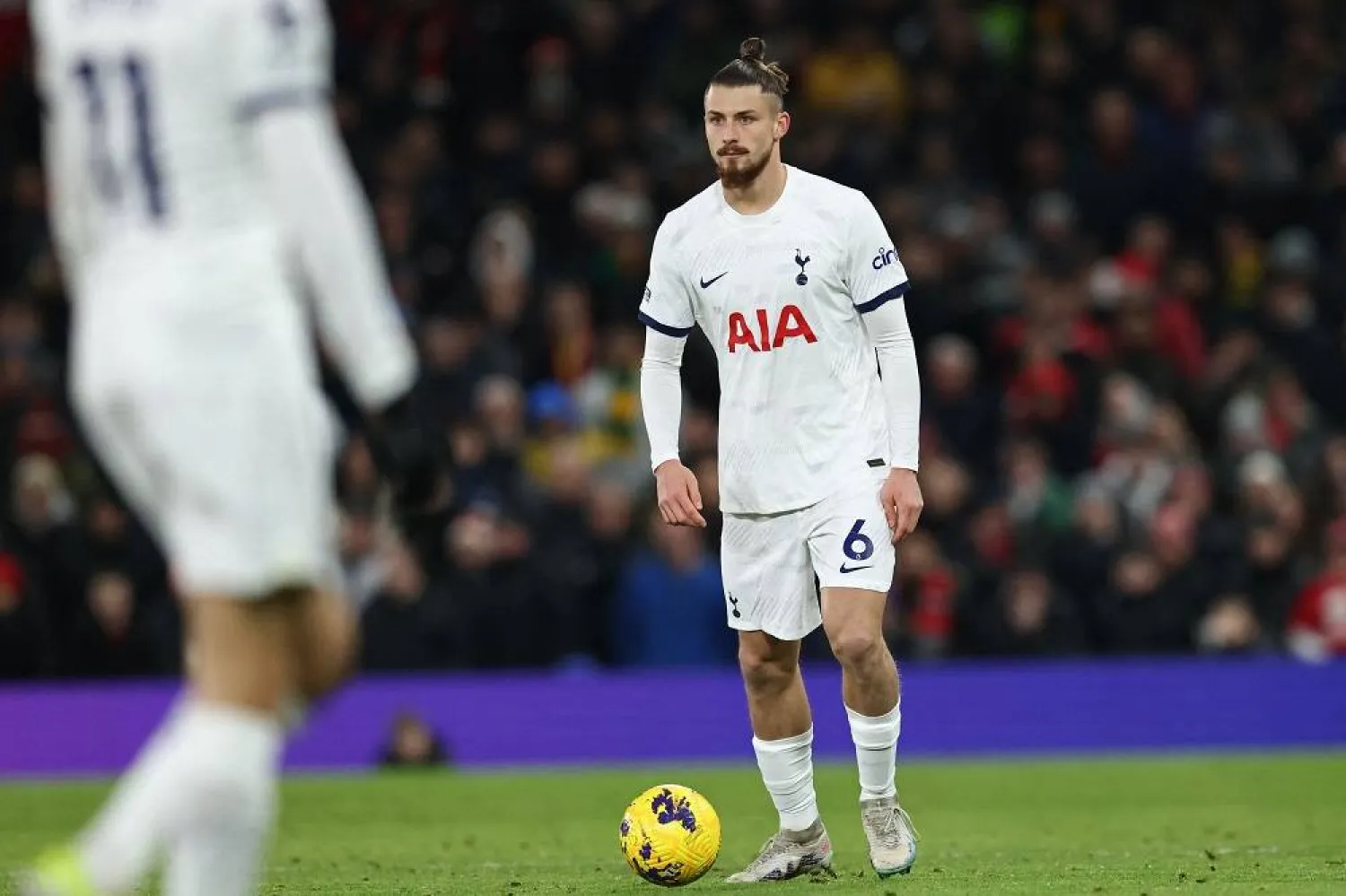 Tottenham Hotspur's Romanian defender #06 Radu Dragusin makes his debut during the English Premier League football match between Manchester United and Tottenham Hotspur at Old Trafford in Manchester, north west England, on January 14, 2024. (AFP)