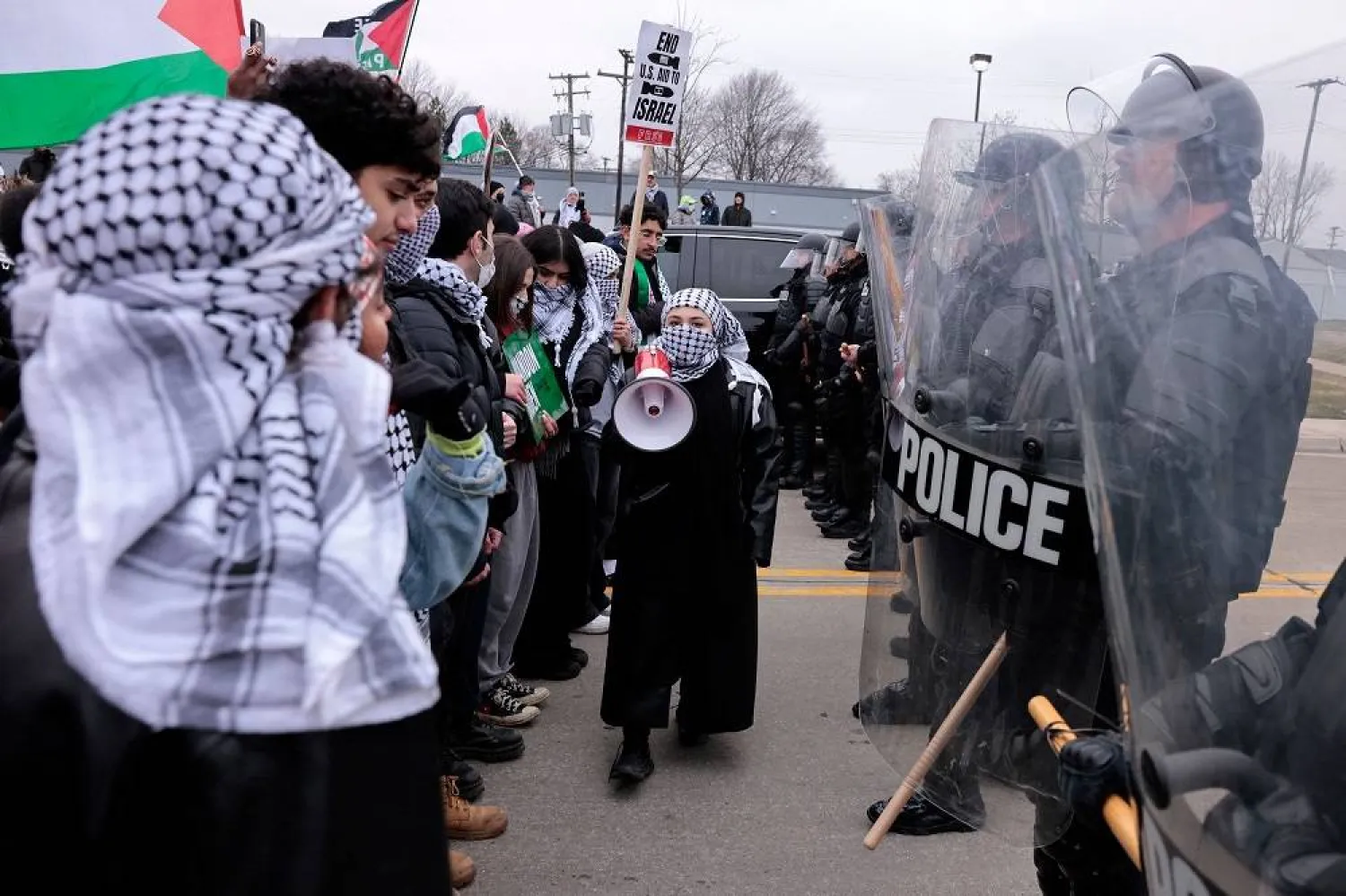 People gather in support of Palestinians outside of the venue where US President Joe Biden is speaking to members of the United Auto Workers (UAW) at the UAW National Training Center, in Warren, Michigan, on February 1, 2024. (AFP)