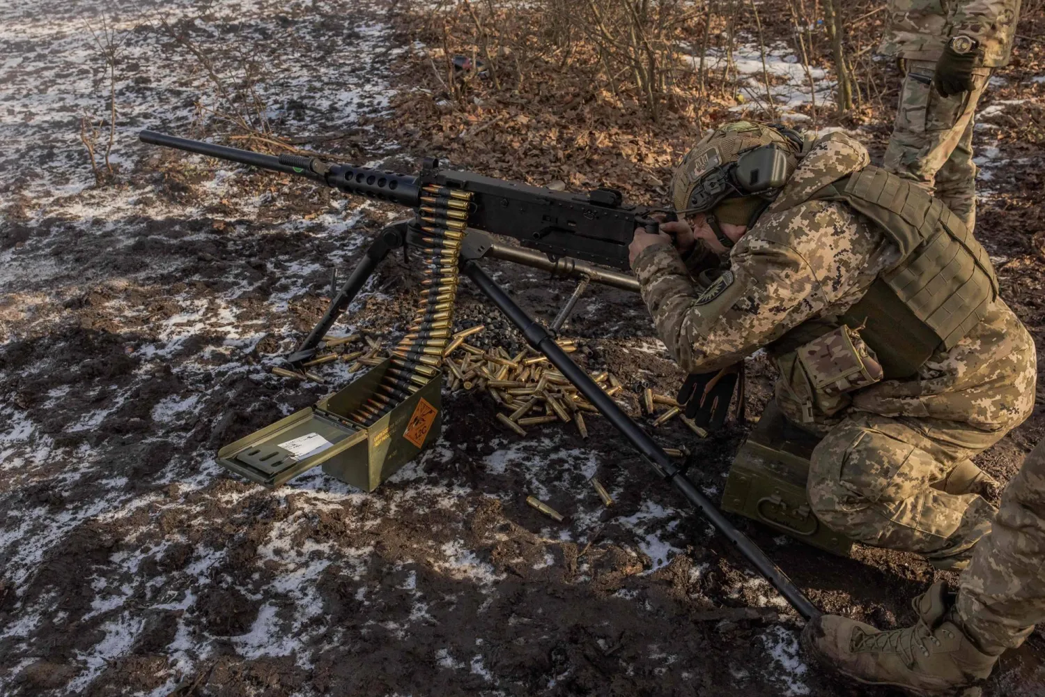 A Ukrainian serviceman of the 22nd Mechanized Brigade shoots with M2 Browning during a military training in the Donetsk region, on January 31, 2024, amid the Russian invasion of Ukraine. (Photo by Roman PILIPEY / AFP)