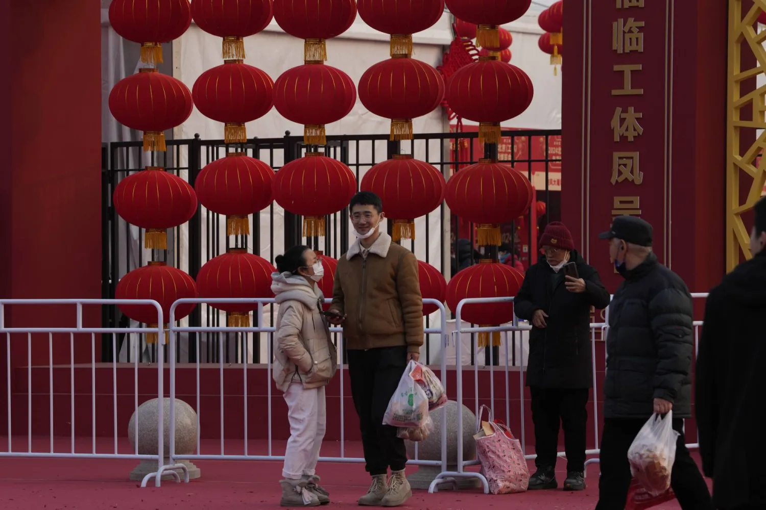 Residents visit a New Year Goods fair ahead of the Chinese Lunar New Year in Beijing, China on Saturday, Jan. 20, 2024. (AP Photo/Ng Han Guan)
