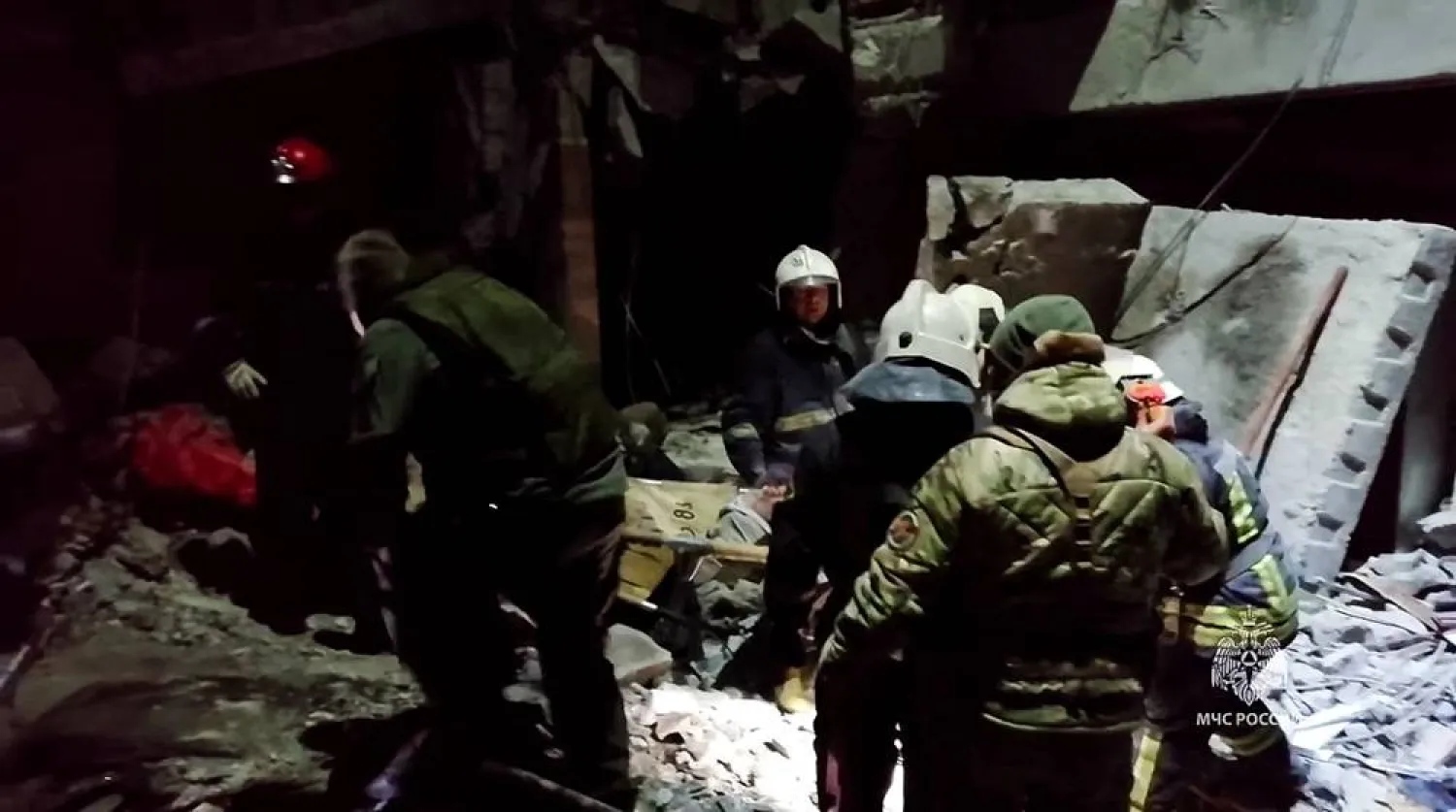 This grab from a handout footage released by the Russian Emergencies Ministry on February 3, 2024, shows rescuers clearing rubble, taking out victims' bodies and searching for survivors inside a destroyed bakehouse hit by recent shelling in the city of Lysychansk. (Photo by Handout / Russian Emergencies Ministry / AFP)
