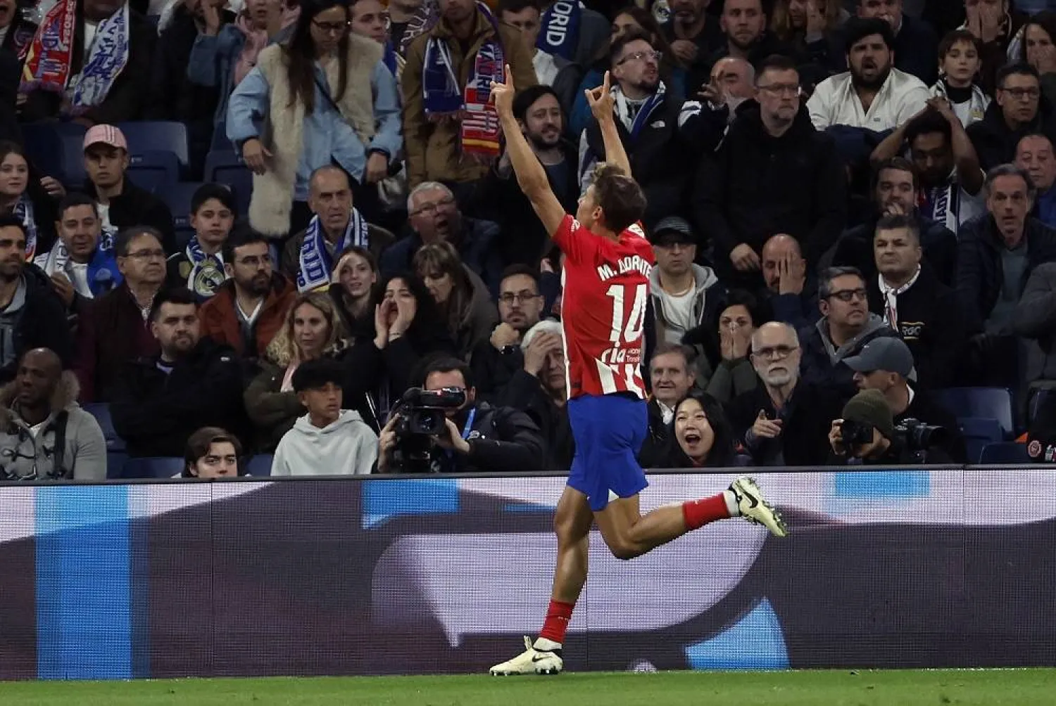 Atletico's midfielder Marcos Llorente celebrates after scoring the 1-1 goal during the Spanish LaLiga soccer match between Real Madrid and Atletico de Madrid, in Madrid, Spain, 04 February 2024. (EPA)
