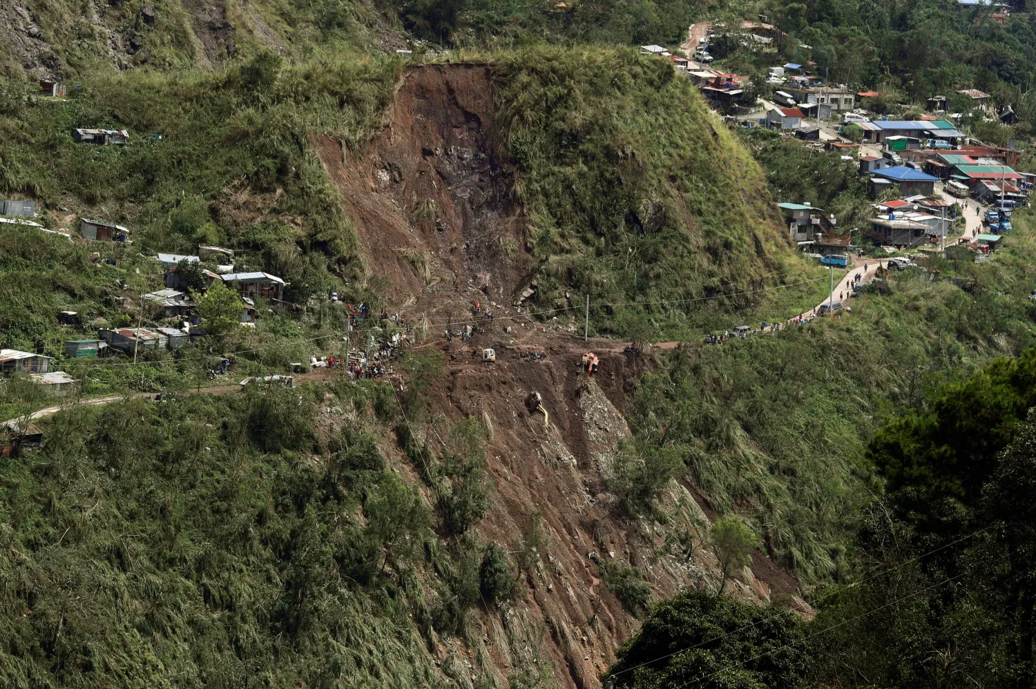 A view shows heavy equipment used by rescuers who were saved after being trapped by a secondary landslide while retrieving survivors from an earlier landslide caused by Typhoon Mangkhut at a mining camp in Itogon, Benguet, in the Philippines, September 17, 2018. REUTERS/Erik De Castro
