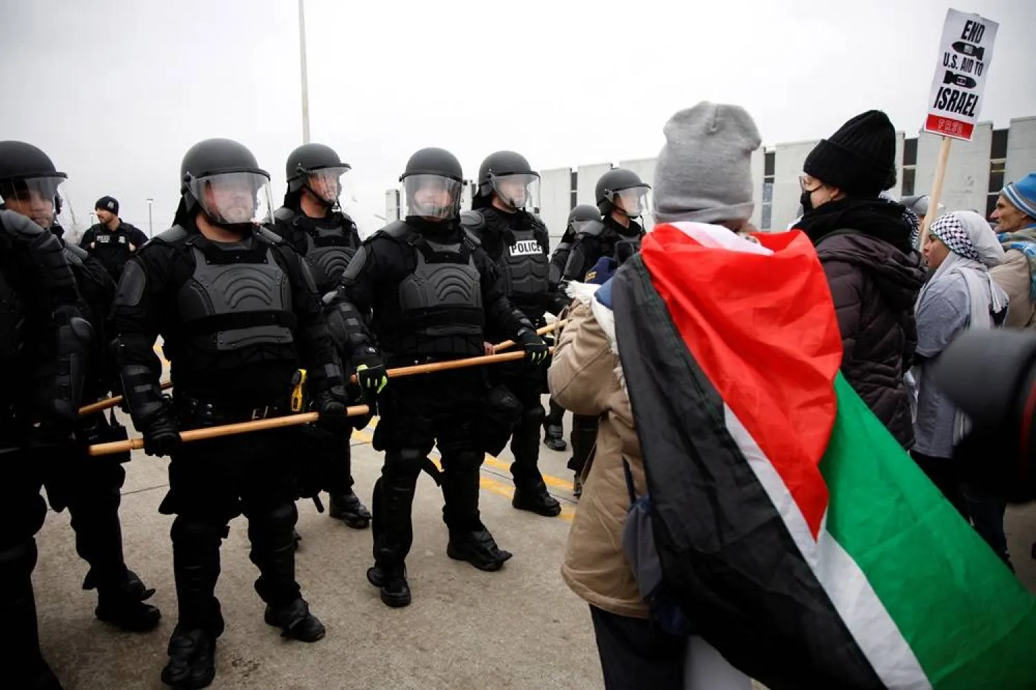  Protestors face-off against police during a rally for a ceasefire in Gaza outside a UAW union hall during a visit by US President Joe Biden in Warren Michigan, US February 1, 2024. (Reuters)