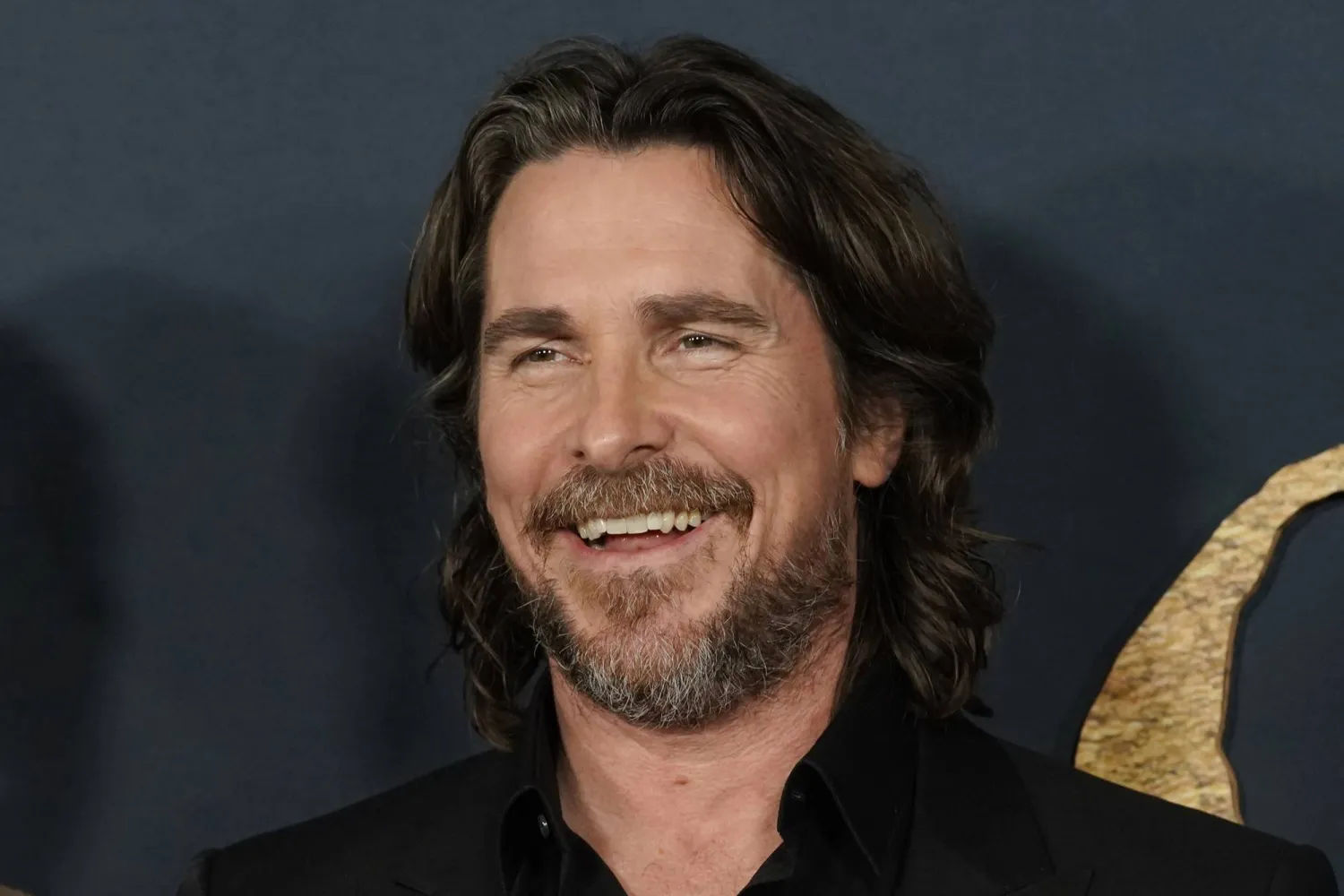 FILE - Christian Bale and cast members in "The Pale Blue Eye," share a laugh at the premiere of the film, Wednesday, Dec. 14, 2022, at the Directors Guild of America in Los Angeles. (AP Photo/Chris Pizzello, File)