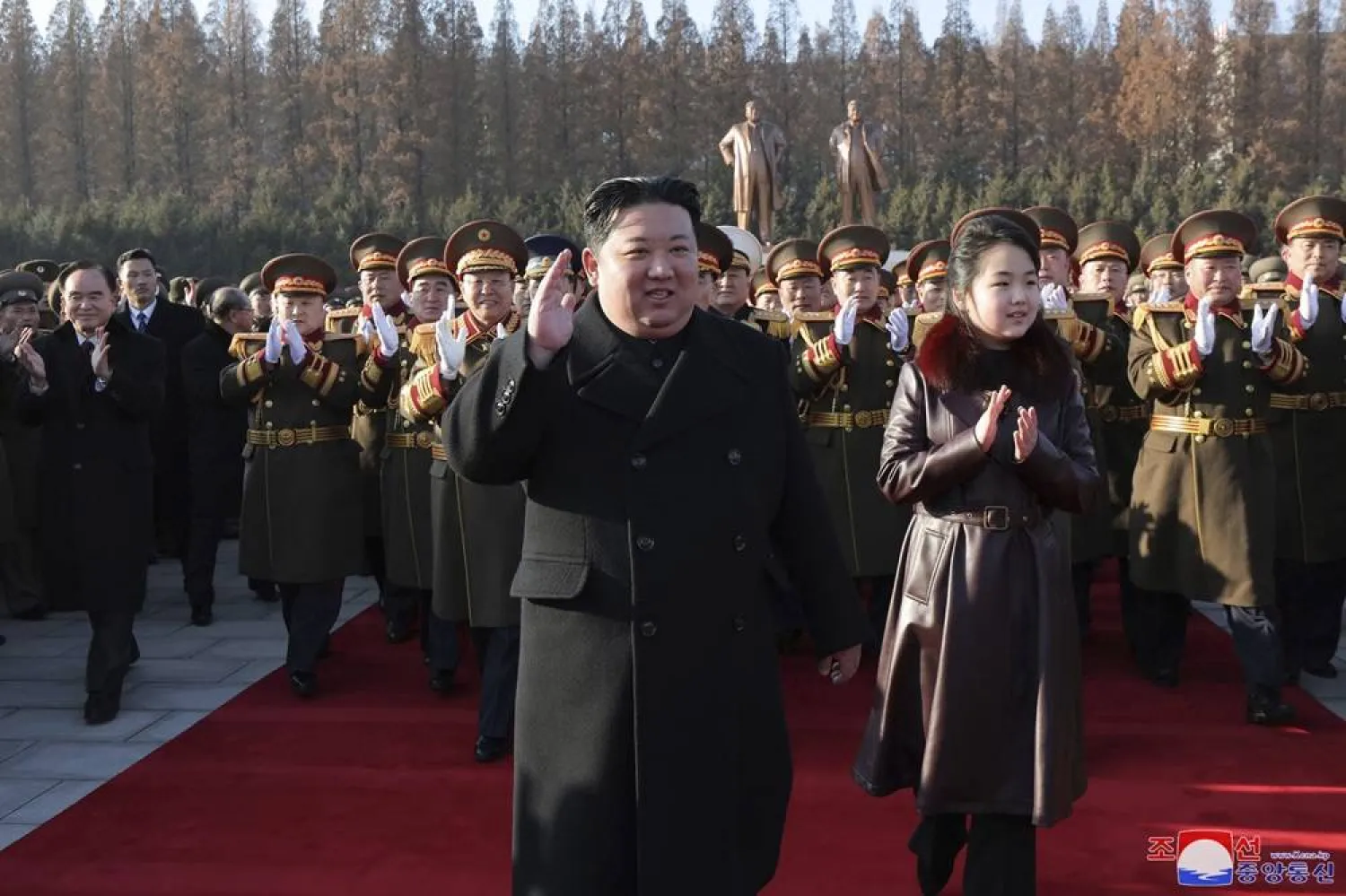 In this photo provided by the North Korean government, its leader Kim Jong Un and his daughter visit the defense ministry for events to celebrate the 76th founding anniversary of the country's army in North Korea, Thursday, Feb. 8, 2024. (Korean Central News Agency/Korea News Service via AP) 