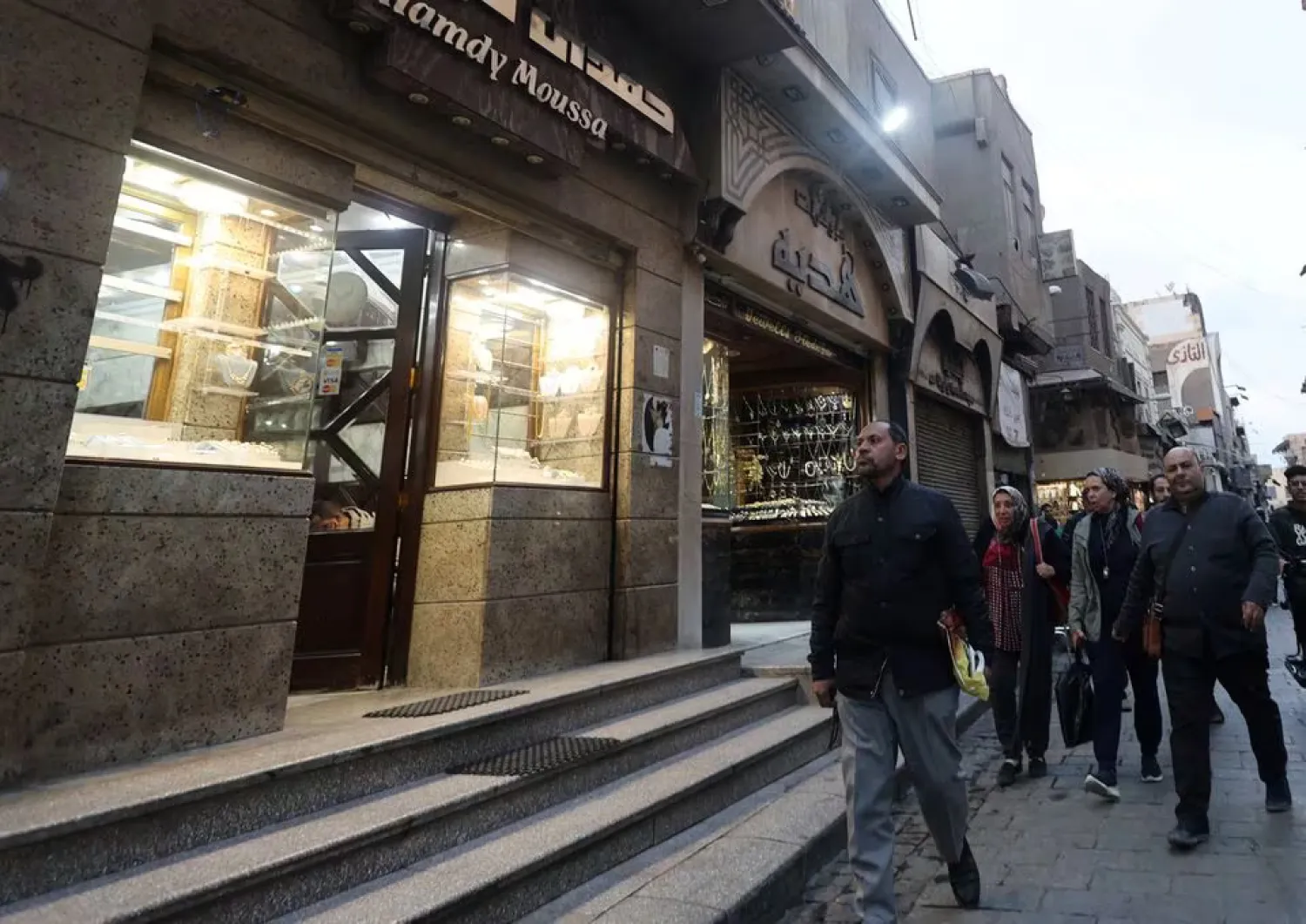 People walk in front of shop markets in the old Cairo, Egypt January 12, 2024. REUTERS/Amr Abdallah Dalsh/File Photo Purchase Licensing Rights