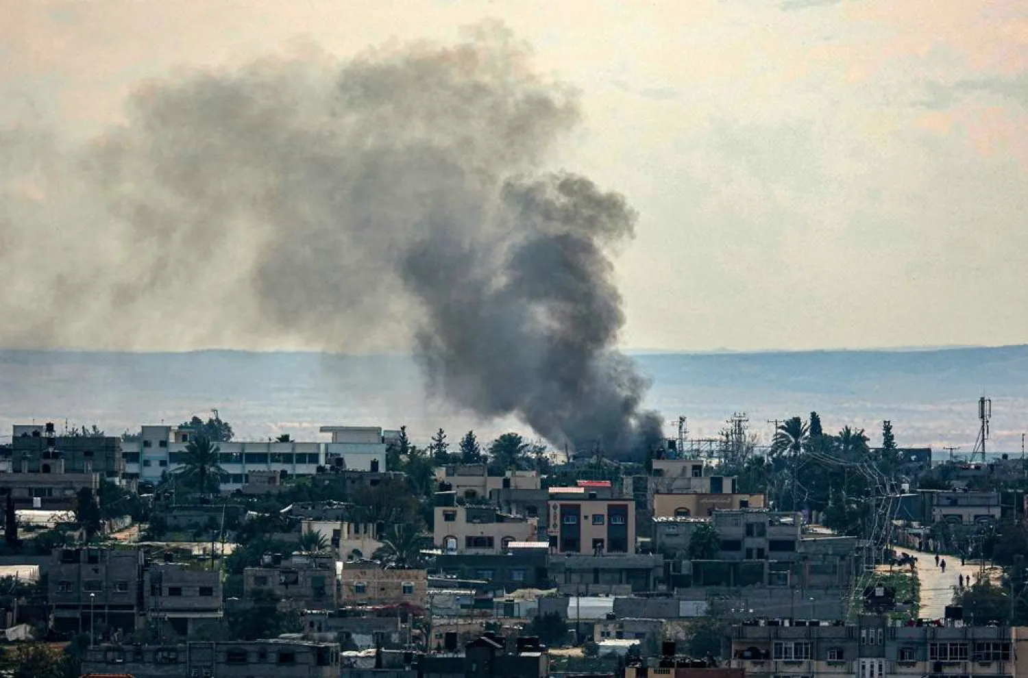  This picture shows smoke billowing following Israeli bombardments over east Rafah in the southern Gaza Strip on February 13, 2024, amid the ongoing conflict between Israel and the Palestinian Hamas militant group. (AFP)