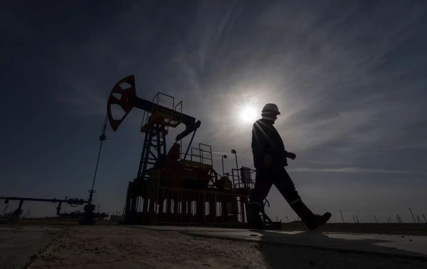 An oil and gas industry worker walks during operations of a drilling rig at Zhetybay field in Kazakhstan (Reuters)

