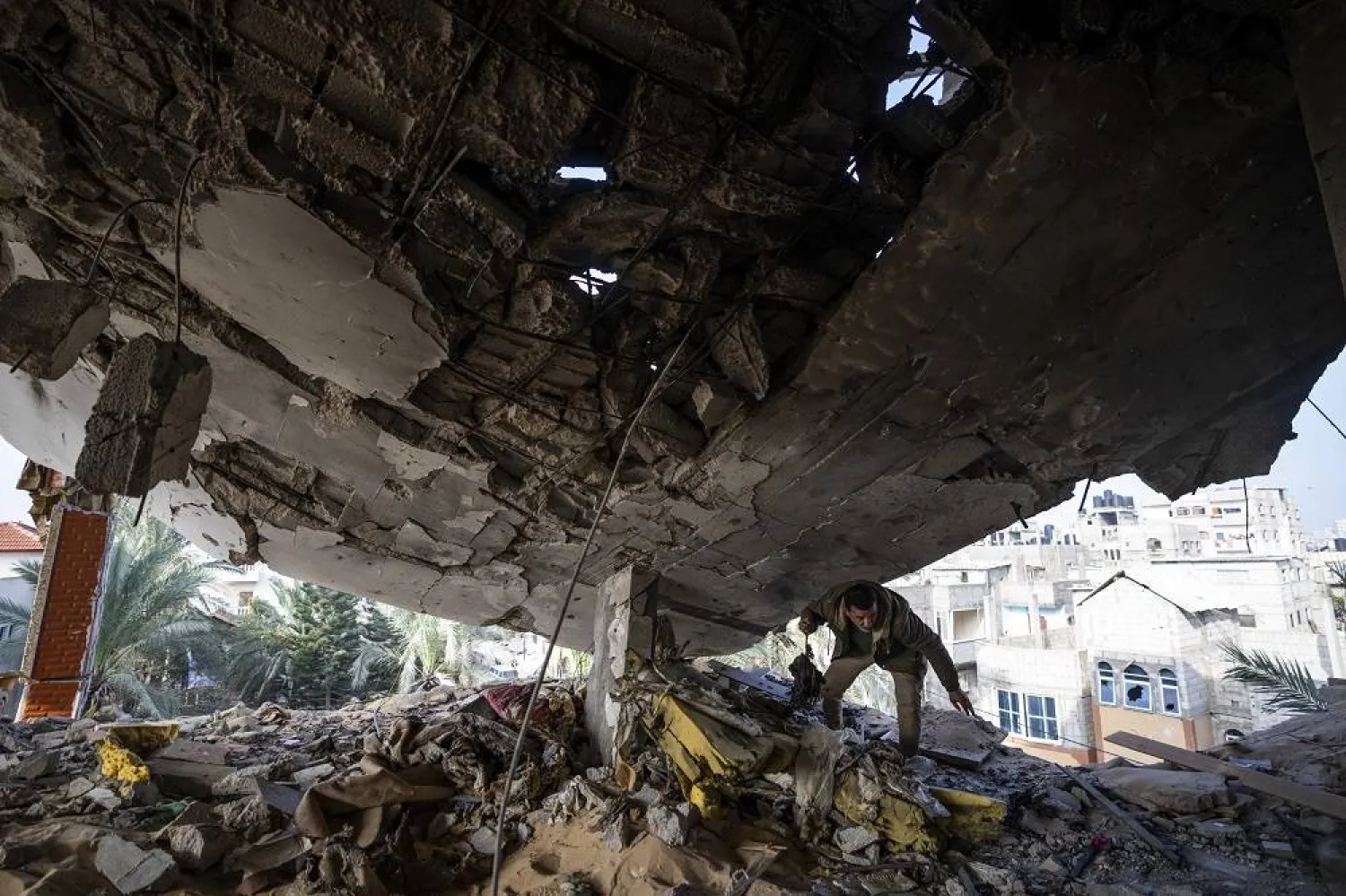 A Palestinian salvages belongings after an Israeli strike in Rafah, Gaza Strip, Saturday, Feb.10, 2024. (AP)