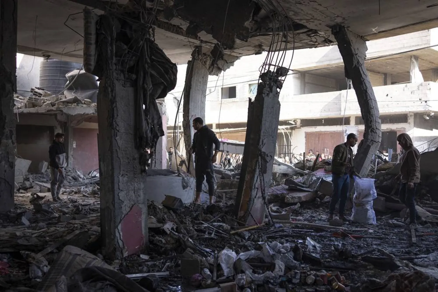  Palestinians check destruction after an Israeli strike in Rafah, Gaza Strip, Saturday, Feb. 24, 2024. (AP)