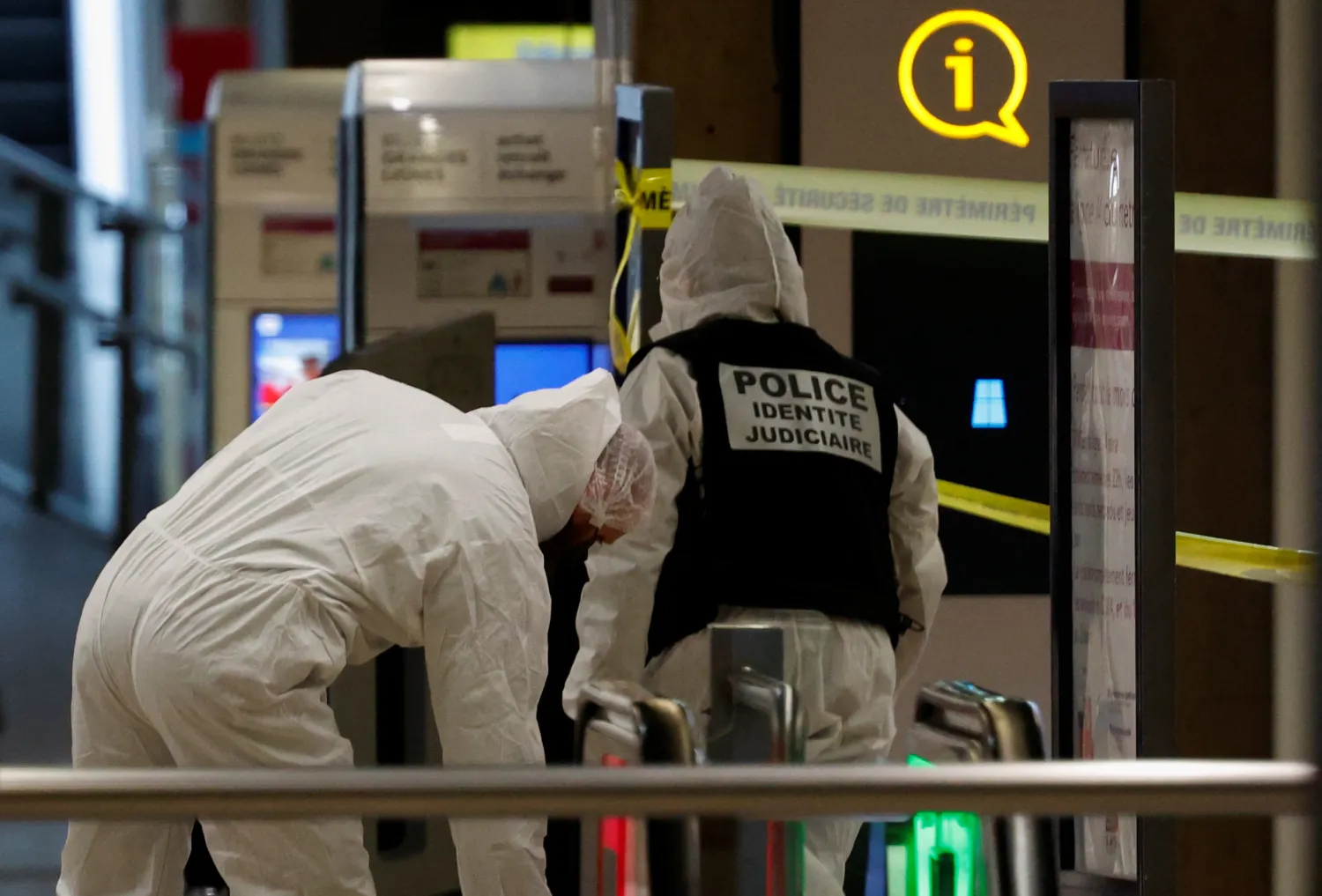 French forensic police officers work on the site after a man with a knife wounded several people at the Gare de Lyon rail station in Paris, France, February 3, 2024. REUTERS/Gonzalo Fuentes