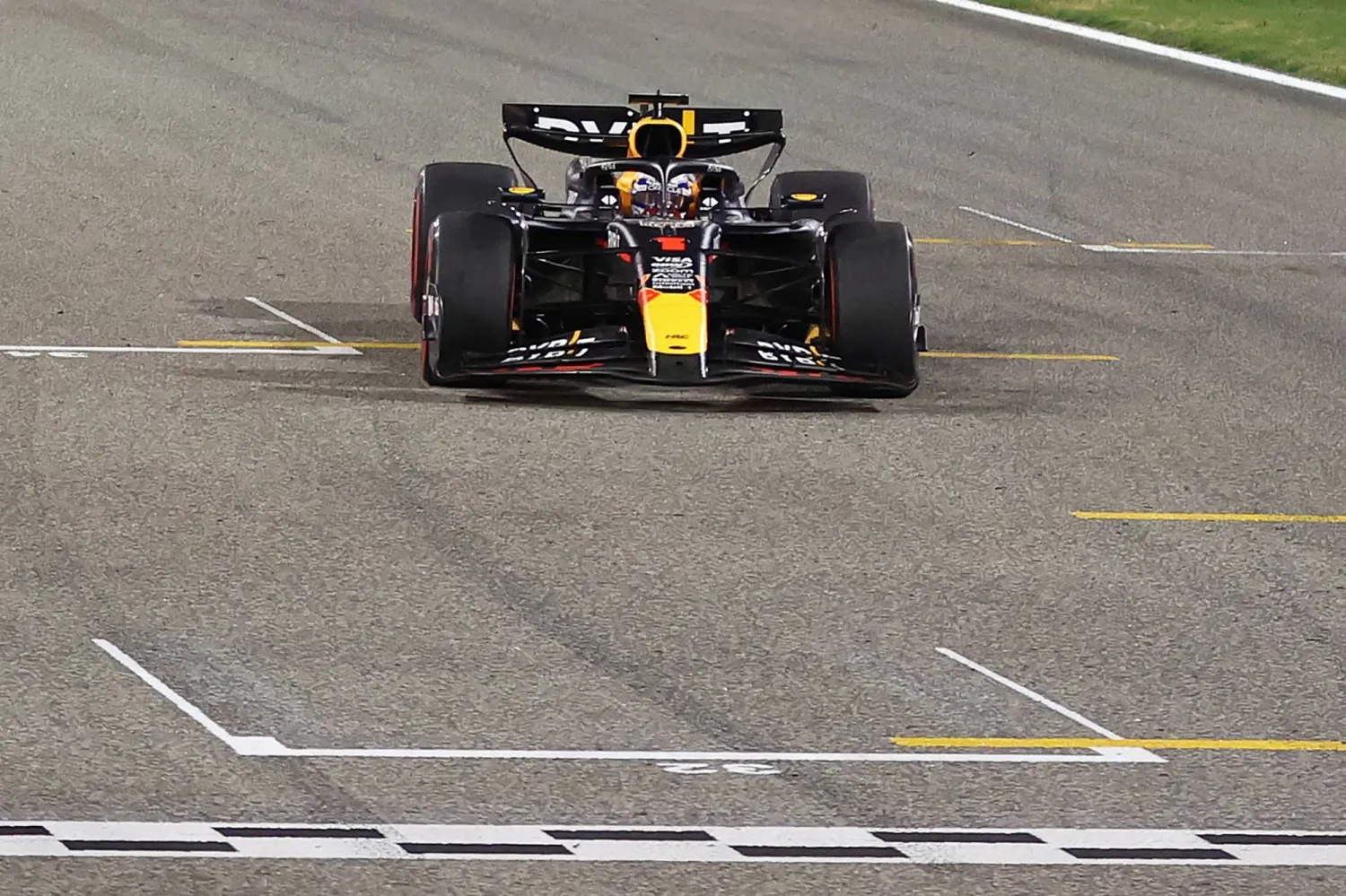 Red Bull Racing's Dutch driver Max Verstappen crosses the finish line to win the Bahrain Formula One Grand Prix at the Bahrain International Circuit in Sakhir on March 2, 2024. (Photo by ALI HAIDER / POOL / AFP)