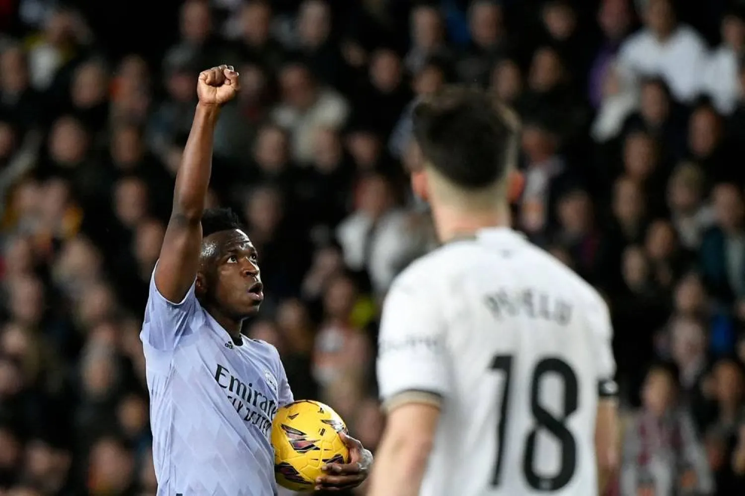 Real Madrid's Brazilian forward #07 Vinícius Júnior celebrates scoring his team's first goal during the Spanish league football match between Valencia CF and Real Madrid at the Mestalla stadium in Valencia on March 2, 2024 (AFP)