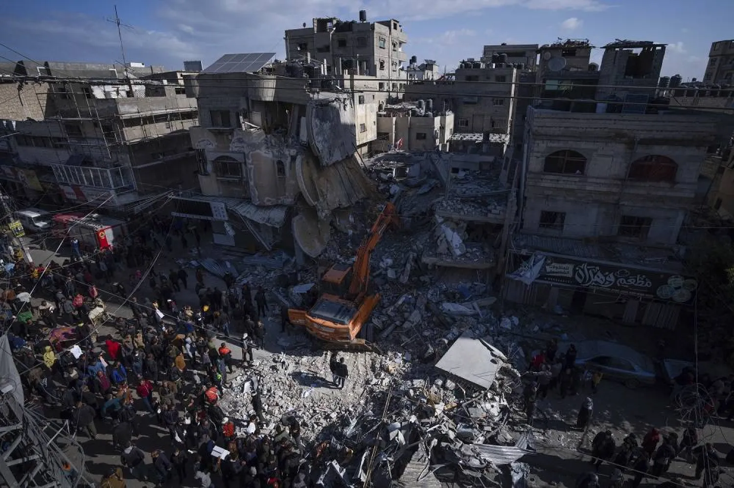 Palestinians search for bodies and survivors in the rubble of a residential building destroyed in an Israeli airstrike in Rafah, Gaza Strip, Monday, March 4, 2024. (AP)