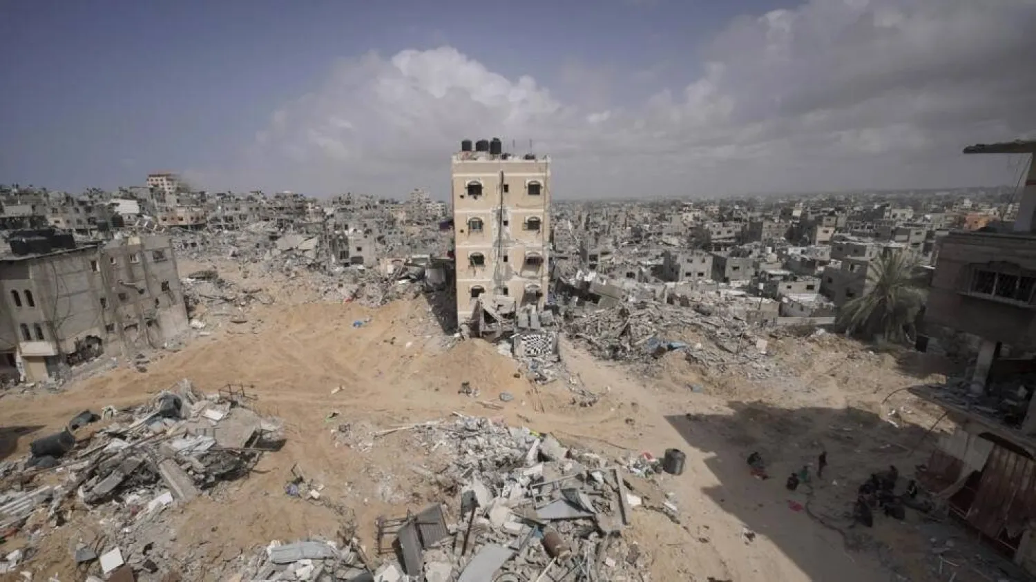 Palestinians stand amid the rubble of houses destroyed by Israeli bombardment in Khan Yunis in the southern Gaza Strip. AFP
